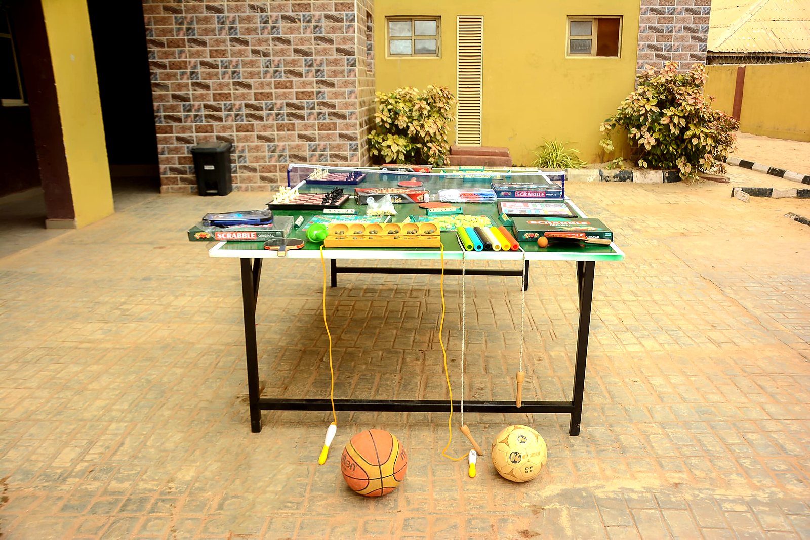 Games and sports equipment set out in the courtyard for a clubs and activities session