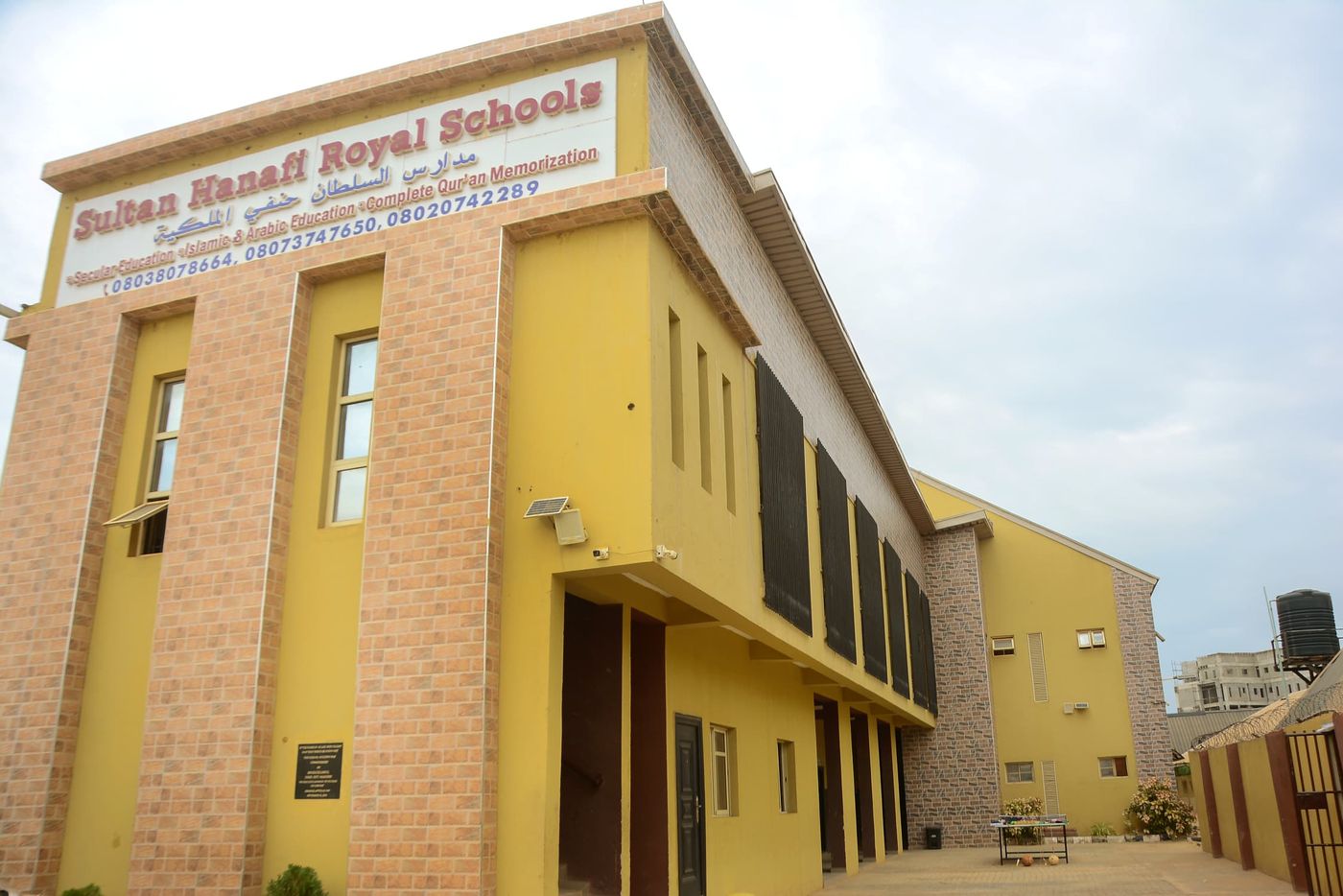 Sultan Hanafi Royal Schools main building, with the school's name displayed in English and Arabic