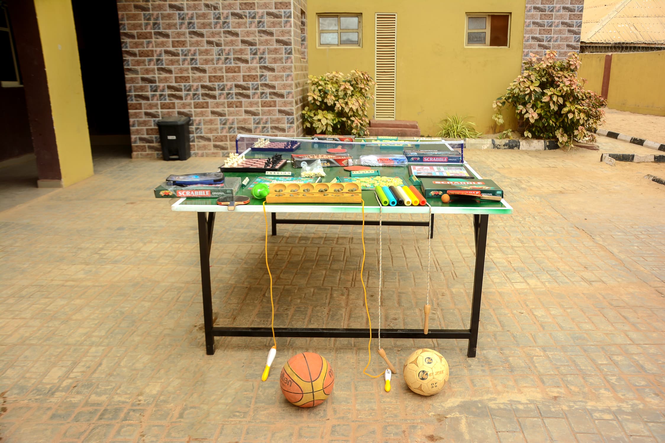 Indoor games equipment including chess, Scrabble, table tennis, and sports balls