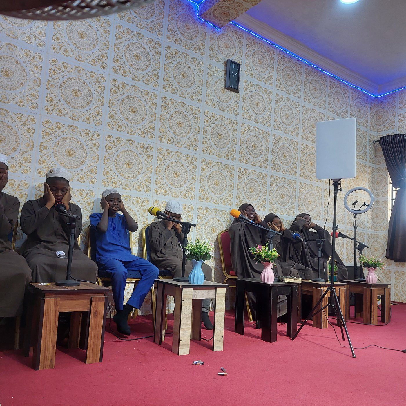 Students gathered for a Qur'an recitation assembly