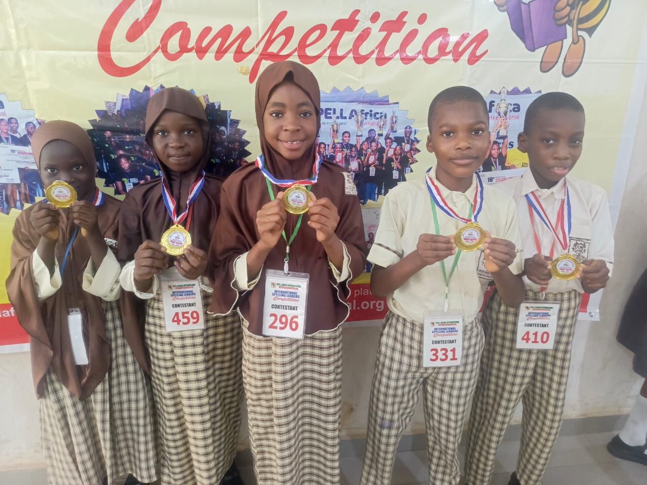 Five Sultan Hanafi Royal Schools students holding gold medals at the SPELL Africa International Spelling Leaders Competition